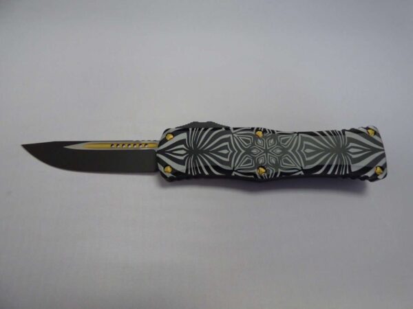 MICROTECH HERA SINGLE EDGE SIGNATURE SERIES TWO-TONED BLACK W/GOLD ACCENTS SOURCE ARTWORK DECLARATION OF AUTHENTICITY PLATE