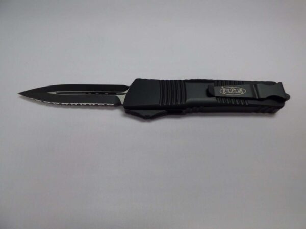 MICROTECH COMBAT TROODON DOUBLE EDGE TACTICAL FULL SERRATED BLACK BLADE/HARDWARE BLADE OUT CLIP SIDE