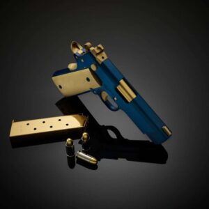 CABOT GUN OF THE MONTH AUGUST ICON ROYALE .45 ACP LEFT SIDE VIEW LAYING FLAT MUZZLE FACING AWAY WITH ACCESORIES