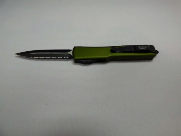 MICRTOECH UTX70 OLIVE DRAB GREEN FULL SERRATED WITH BLADE BLADE/HARDWARE BLADE OUT CLIP SIDE