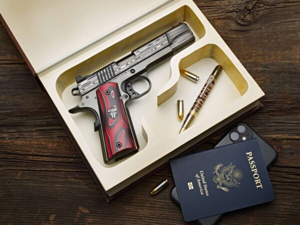CABOT GUN OF THE MONTH 2023 JUNE 1911 BEDSIDE DEMON 9MM RIGHT SIDE VIEW IN CASE BOOK