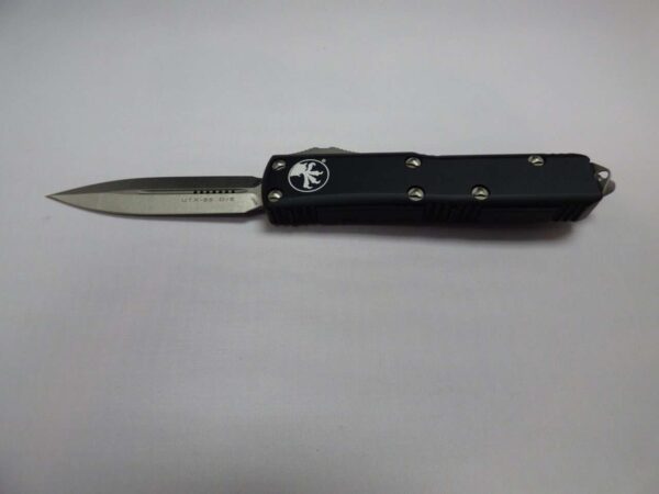 microtech utx-85 double edged stonewashed blade with silver hardware open non clip side
