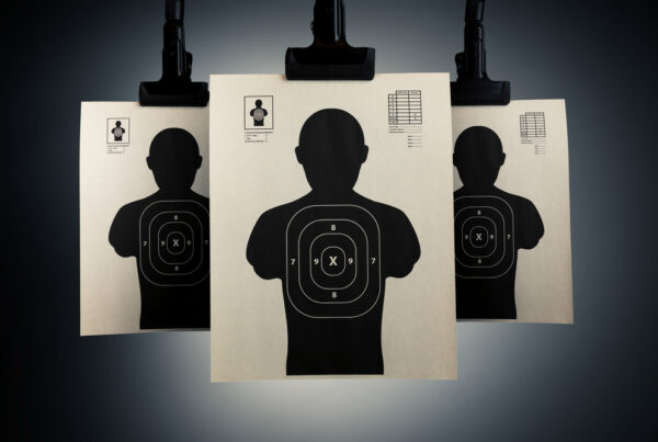 Shooting targets hanging on a grey background